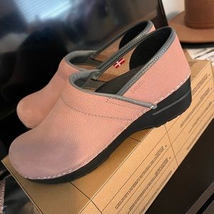 Sanita leather clogs.